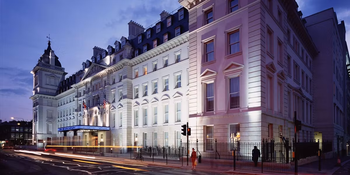 Hilton Paddington (hotel) 1 City street exterior view of a historic illuminated building at dusk
