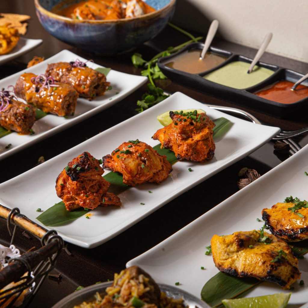 Corporate Event 3 Platter of grilled meat dishes with sauces served at a corporate catering event