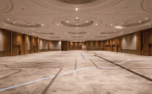 Wedding venue hall interior decorated in warm gold tones