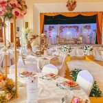 Banqueting hall set up with round tables for a wedding reception