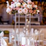 Tall blush pink floral centrepiece on a wedding table