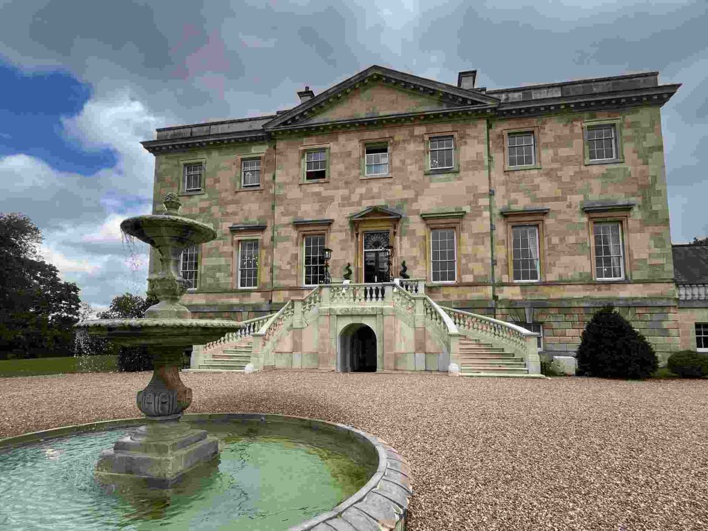 Botleys Mansion (Manor House) 1 Stone mansion venue exterior with a fountain and grand staircase entrance